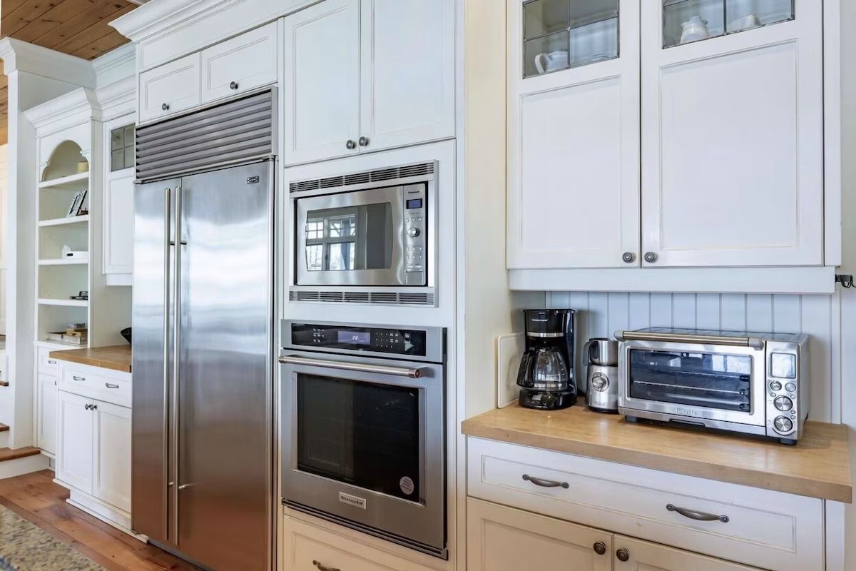 Kitchen appliances — built-in refrigerator, oven, and coffee station