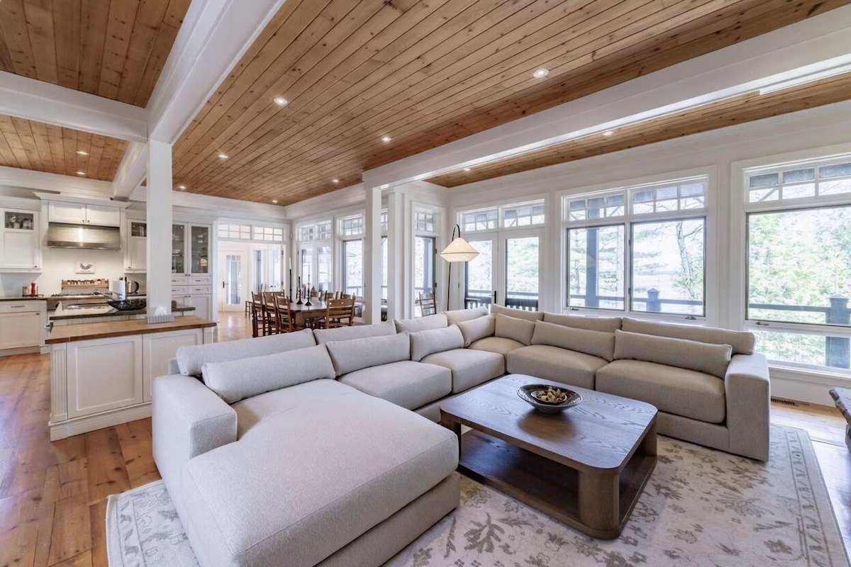 Linen sectional facing the lake windows and the covered porch